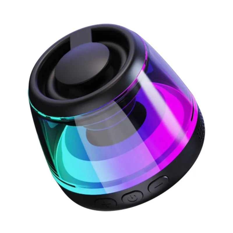 Portable white Bluetooth speaker with magnetic base, mood light, and card slot on a desk.