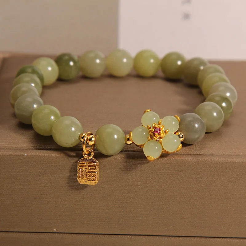 Women's casual fashion bracelet in a grey jade colour with alloy metal construction.
