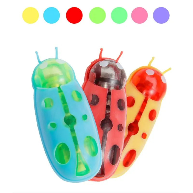 Electric crawling bug cat toy with ladybug shape on hard surface