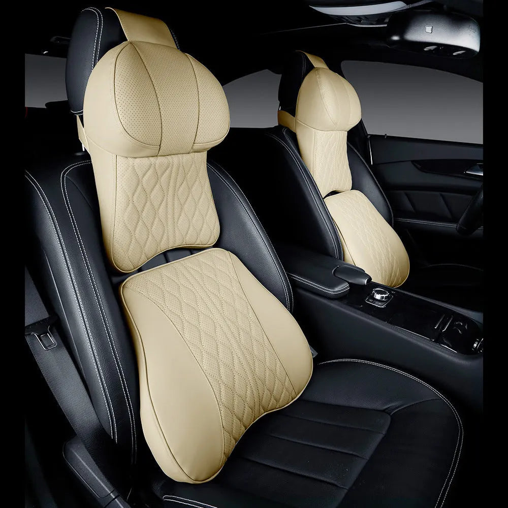 Beige and black car neck pillow and matching lumbar support pillow with wavy pattern.