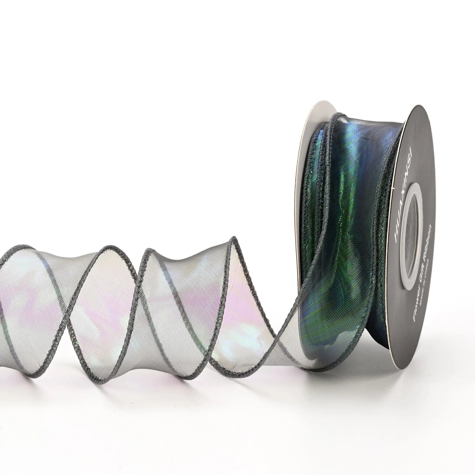 Roll of 4cm wide colourful mesh ribbon with fishtail yarn floral wave design.