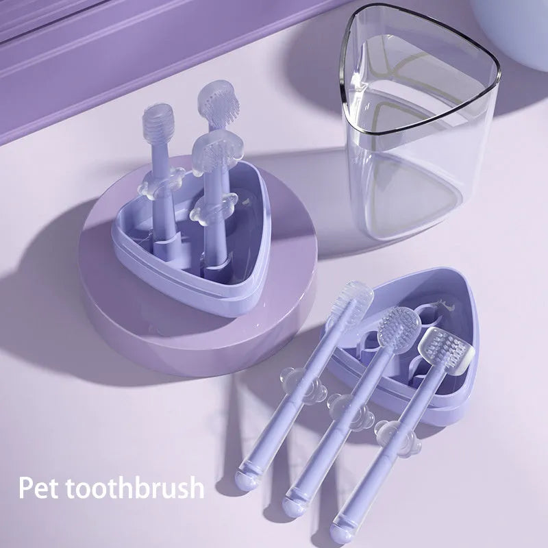Blue, green, and purple pet toothbrushes with soft silicone bristle heads for dogs and cats.