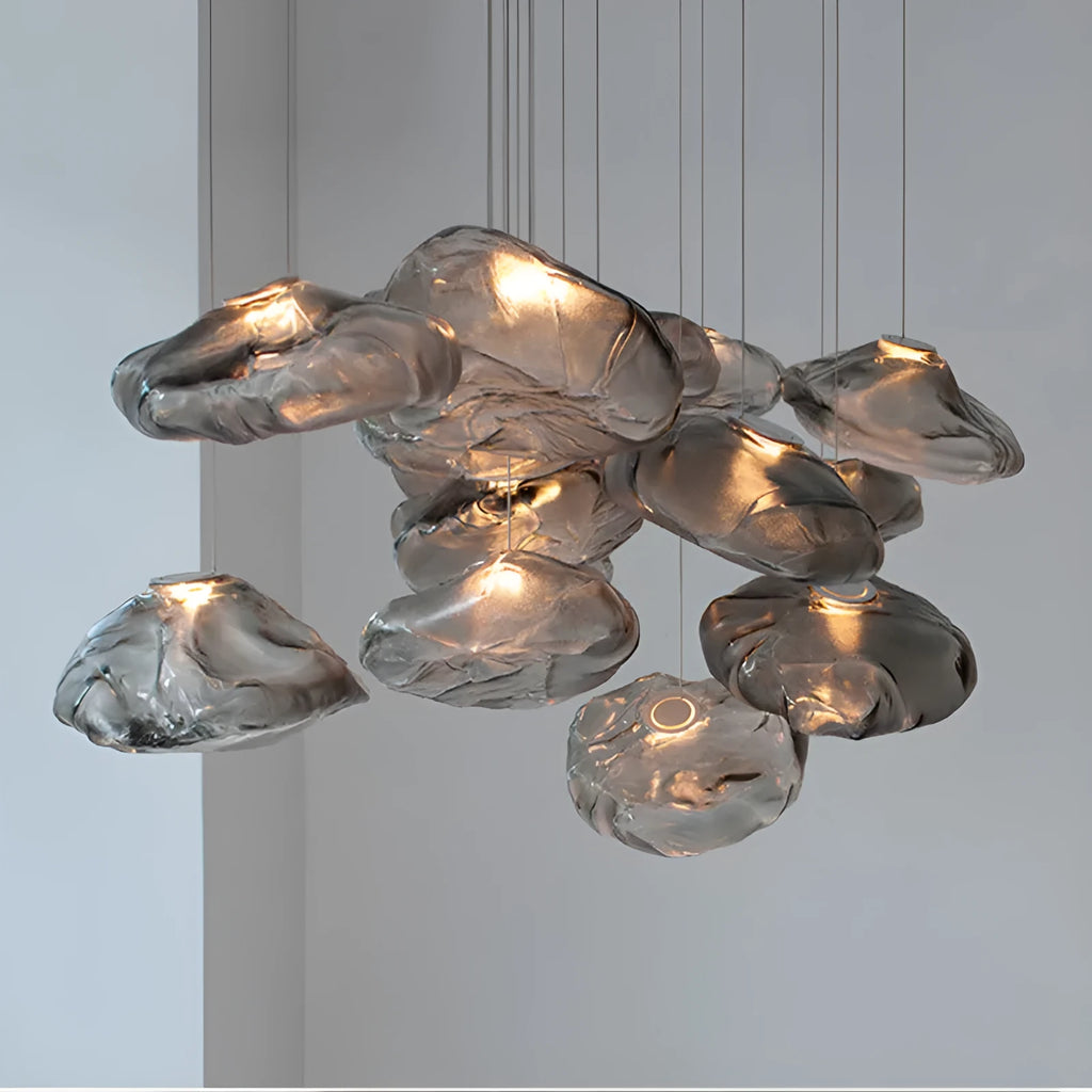 Postmodern style fabric chandelier with glass shade, shown in amber, clear, and smoke grey colours.