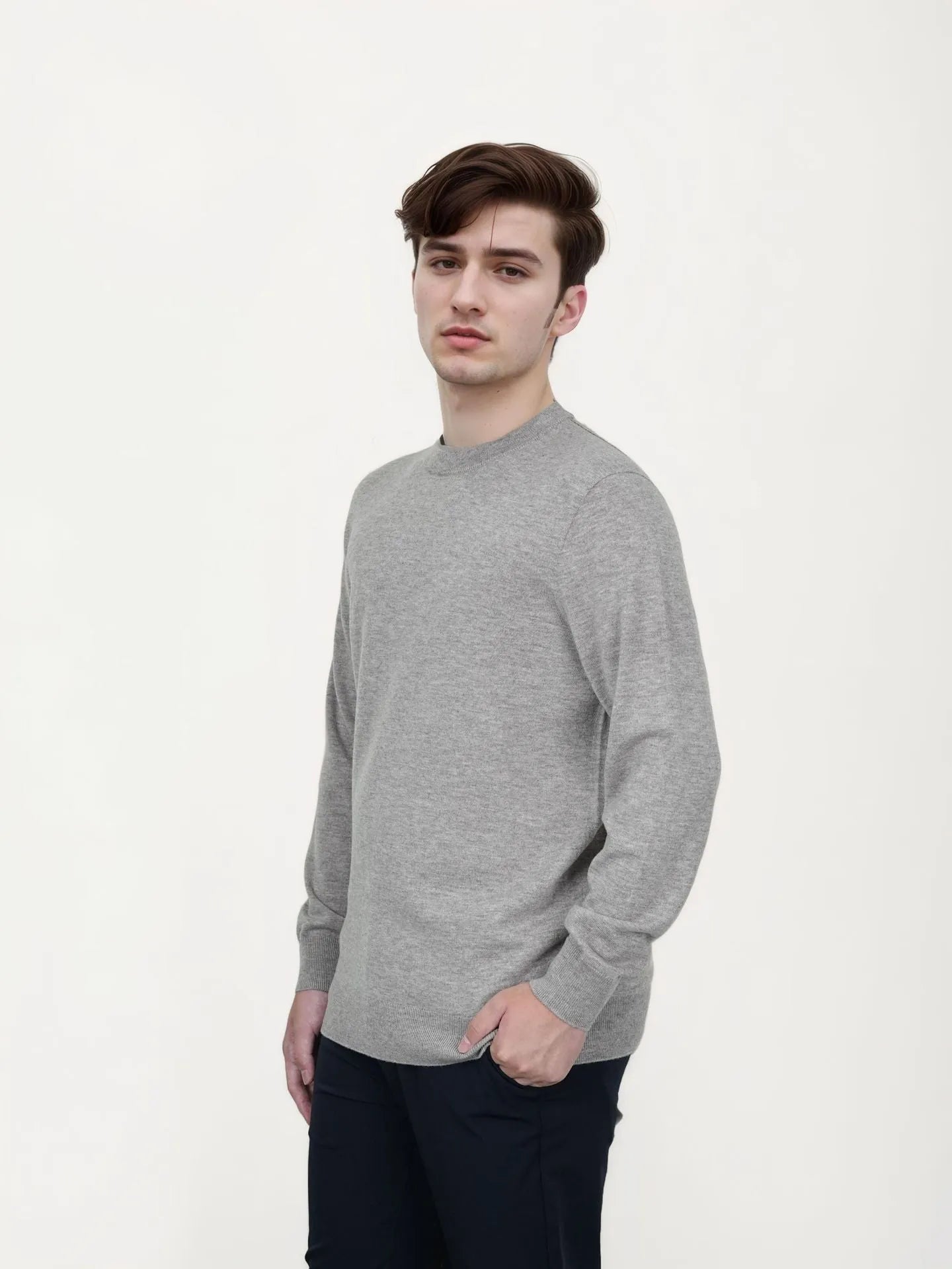 Man wearing a standard wool pullover sweater in light grey, regular fit, for autumn and winter.