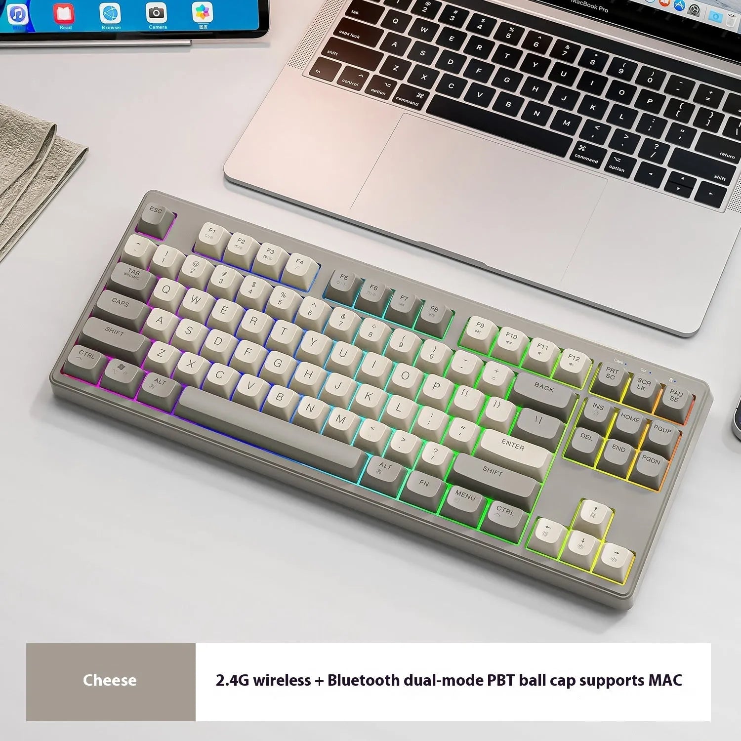 Compact wireless Bluetooth keyboard in blueberry colour with USB receiver and cable on a desk.