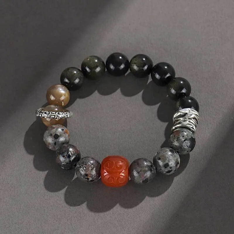 Handcrafted red agate and golden obsidian Wukong bracelet with flame stone pattern