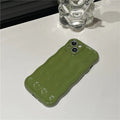 Soft silicone iPhone 17 case with water ripple texture in wavy green colour.