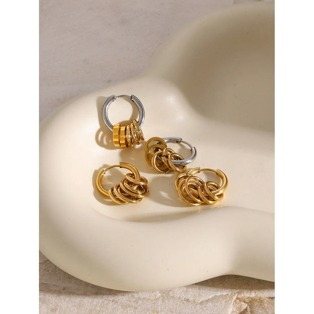 Pair of stainless steel ins style earrings with an electroplated silver-toned finish.