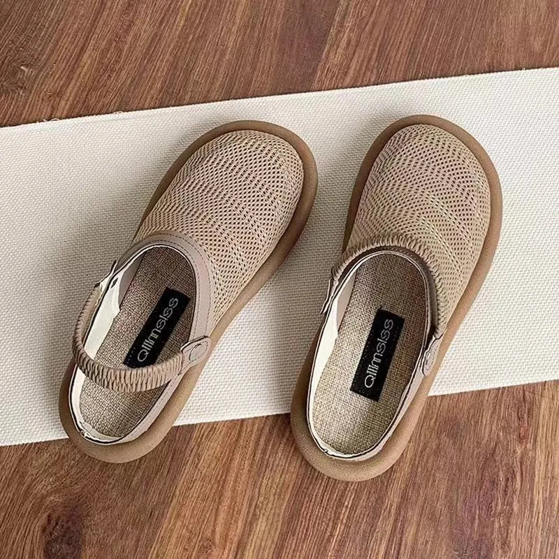 Beige linen slip-on hole shoes with mesh lining and a soft rubber sole, shown in a low-top style.