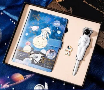 Galaxy Dream A5 notebook with cartoon astronaut design, gift box, and accessories.