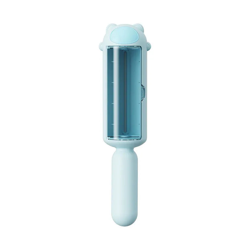 Blue reusable pet hair remover tool with self-cleaning base on a carpet.