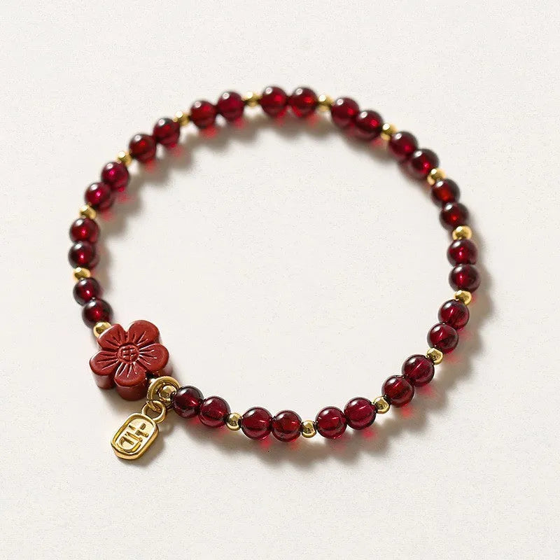 Simple geometric women's bracelet with natural freshwater pearls and crystal details on an elastic rope band.