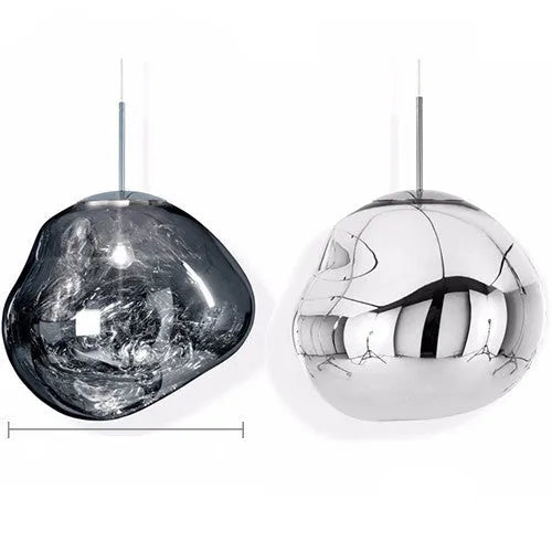 A modern irregular shaped glass chandelier with a Nordic design in a gold finish, hanging from a ceiling.
