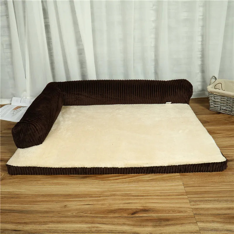A grey corduroy bilateral-style dog sofa bed on a wooden floor