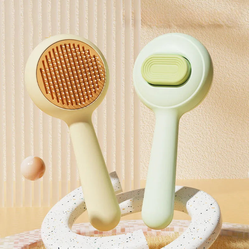 Stainless steel cat grooming brush with non-slip plastic handle in green colour