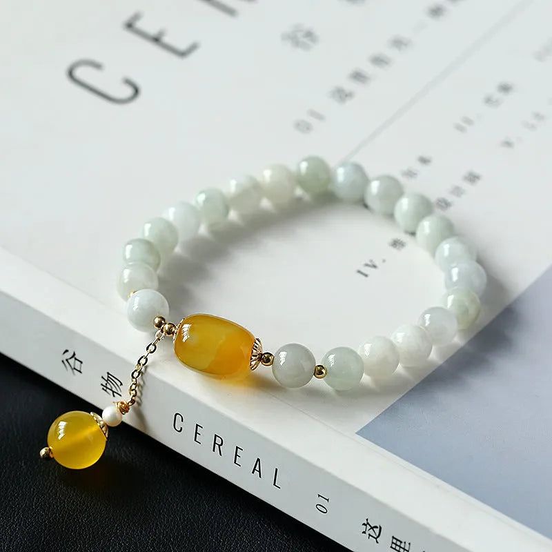 Women's ethnic geometric bracelet with hanging red agate beads and 14K gilded finish