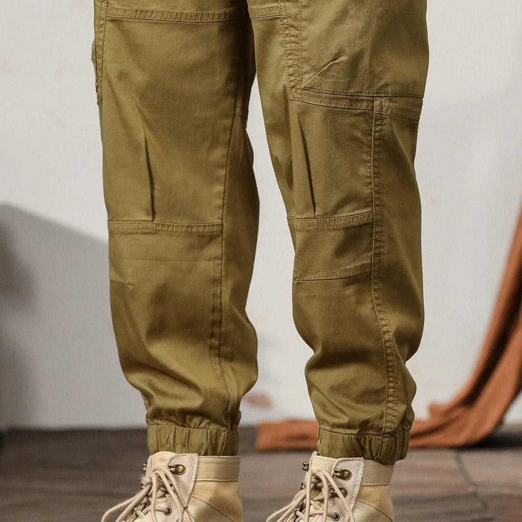 Men's tapered harem trousers in cotton with ankle band and zip placket front