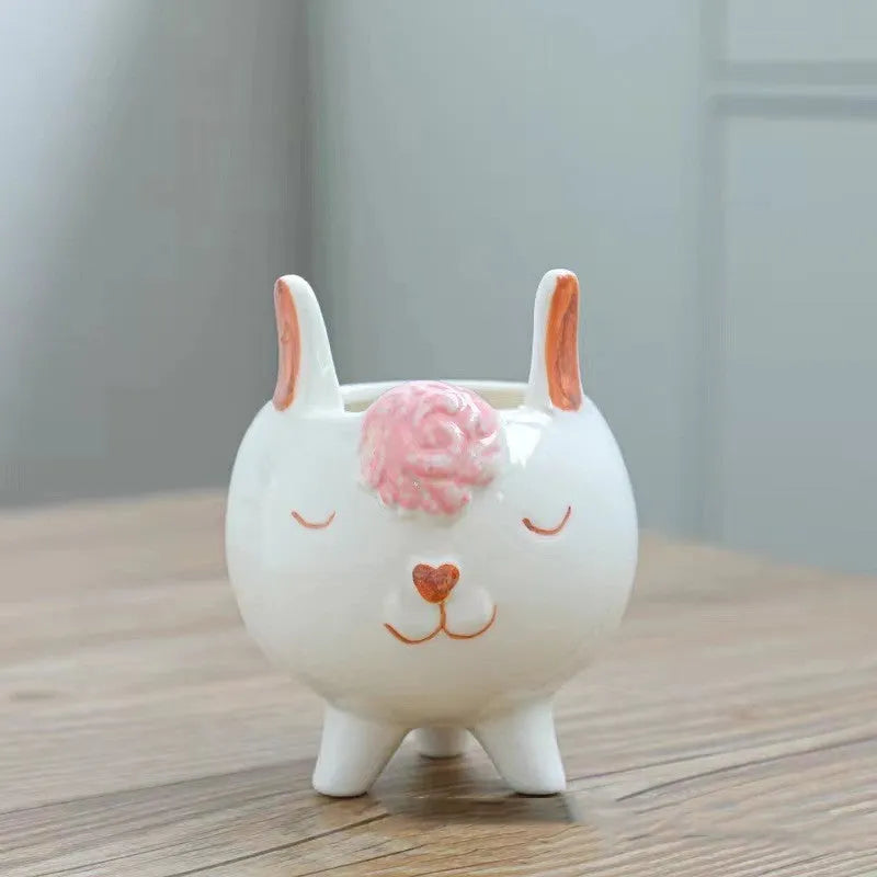Hand-painted ceramic succulent flowerpot with cartoon animal and flower design in pastoral style.