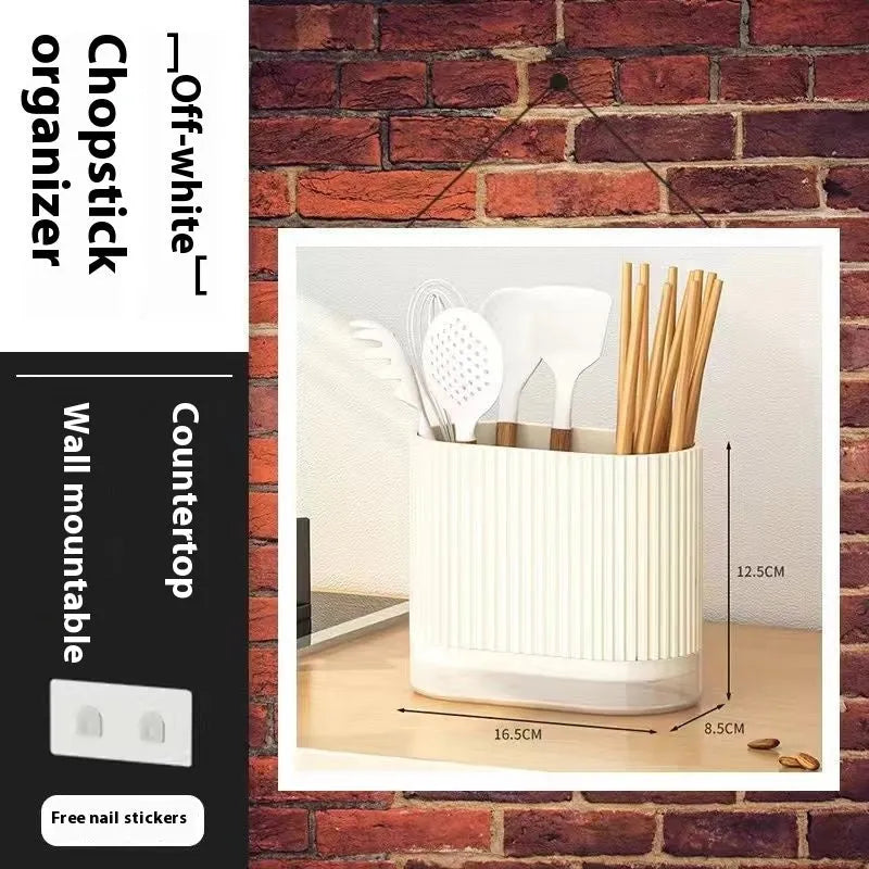 Modern plastic chopsticks tube holder mounted on kitchen wall holding utensils