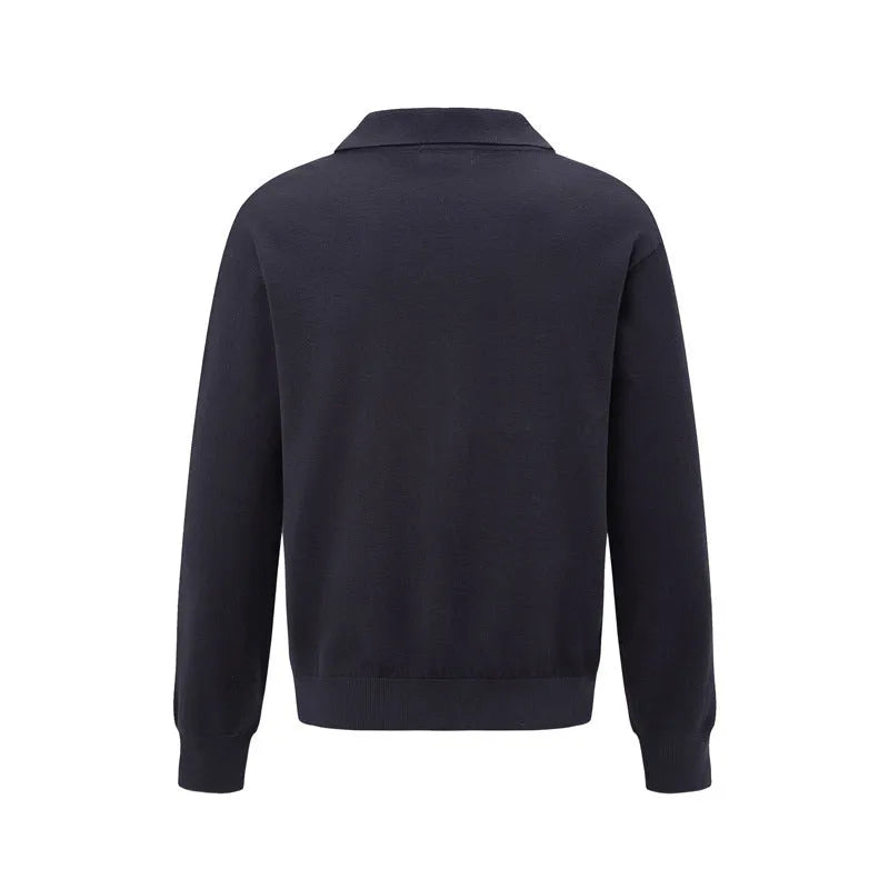 Man wearing a loose fit black acrylic pullover sweater for casual wear.