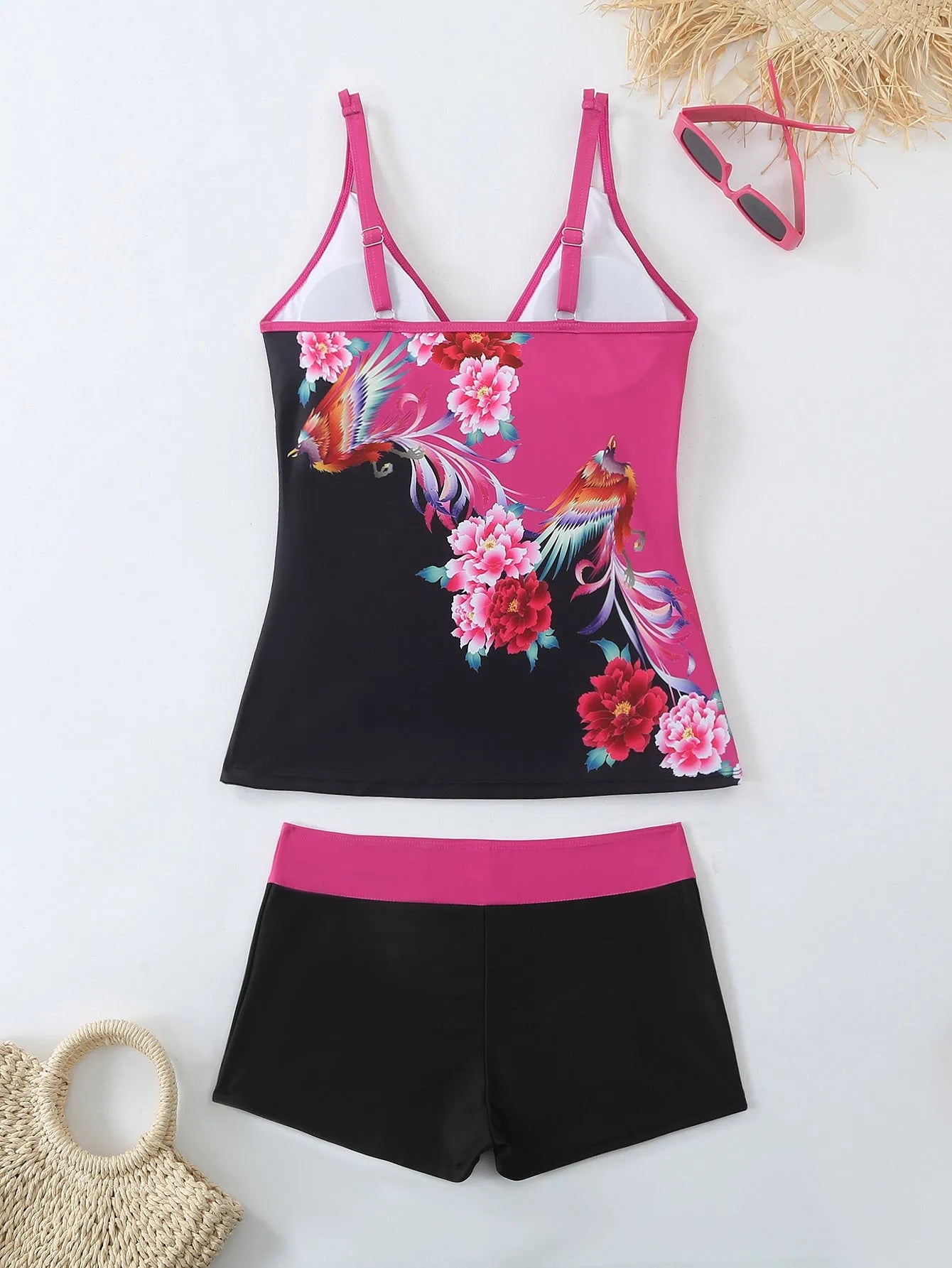 Women's plus size black and rose red two-piece swimsuit bikini set on a mannequin.