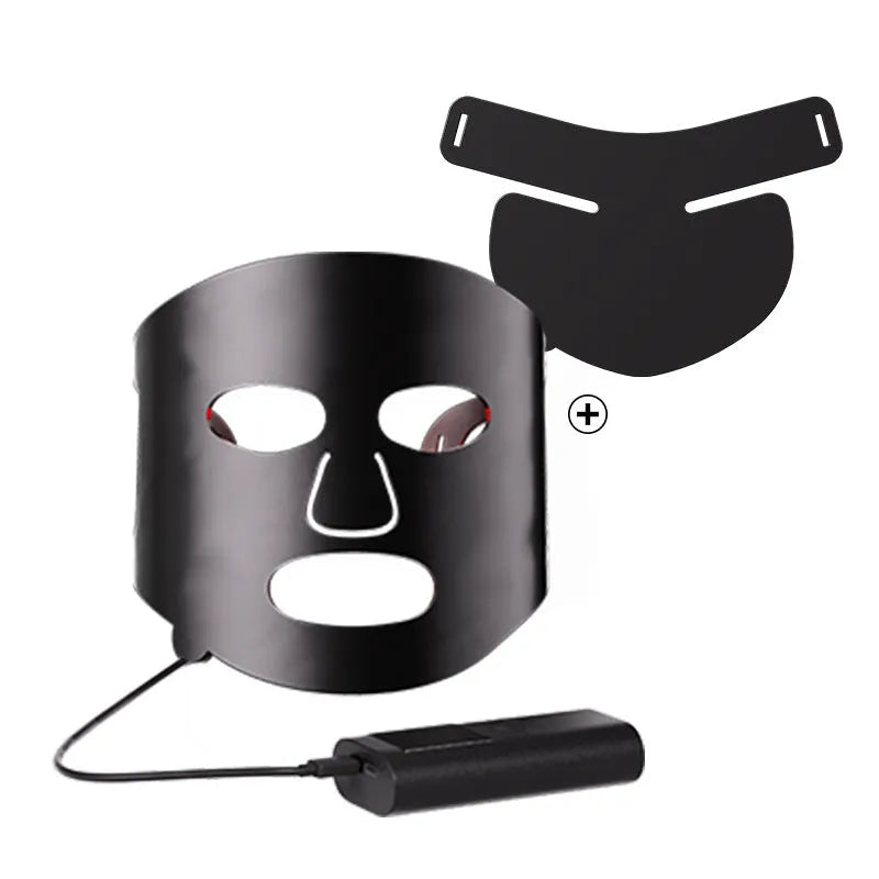 Black and white LED light therapy face mask with controller for home skin treatment.