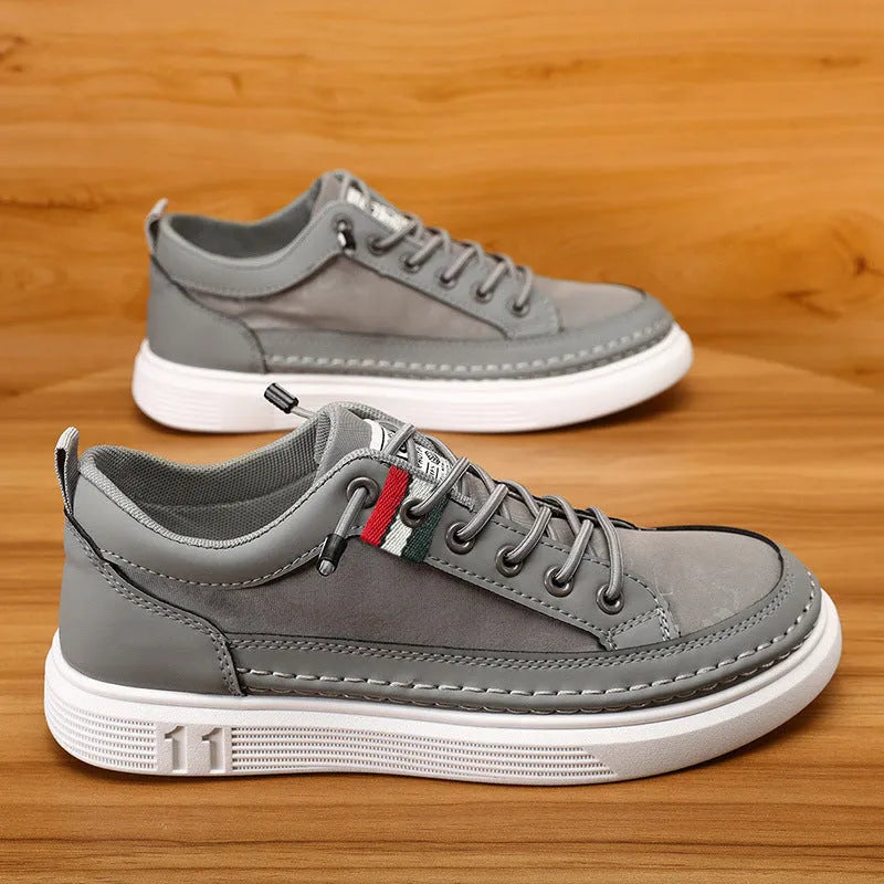 Men's grey high-cut casual sneakers with a bandage dress style, round toe, and a PU upper.