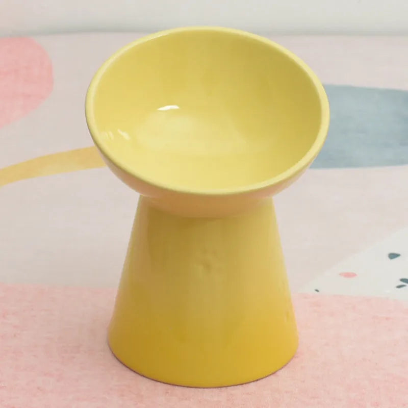 White ceramic pet bowl with a high foot neck and slanted rim for cat or dog feeding