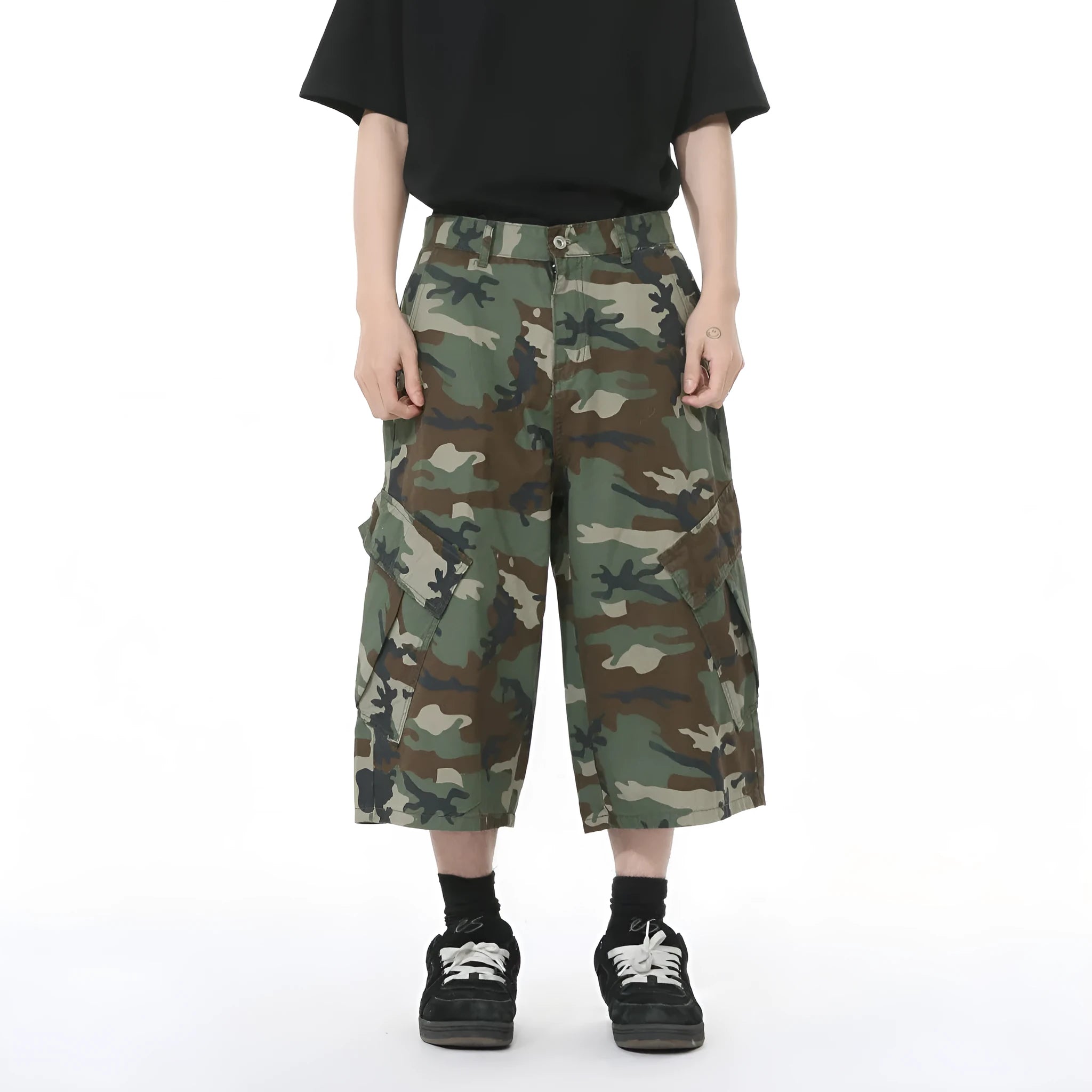 Men's camouflage print cotton jeans with a wide leg, cropped length, and large front pockets.