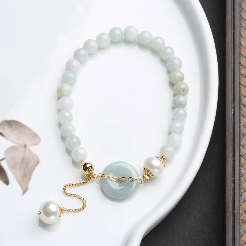 Natural emerald green jade bracelet with pearl accents and peace symbol buckle clasp
