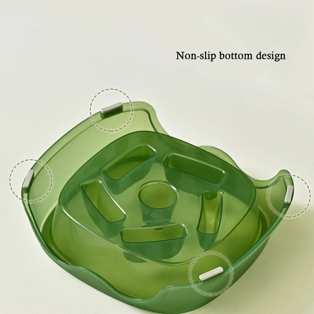 Blue plastic slow-feed dog bowl on a floor to prevent choking.