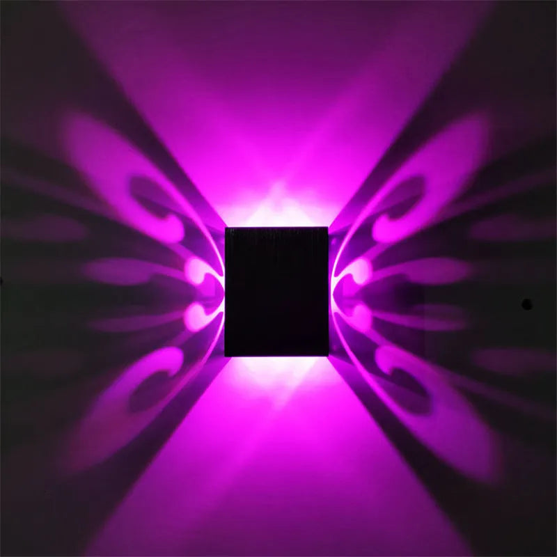 Modern aluminium butterfly-shaped LED wall lamp with remote control for seven colour options.