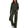 Women's long-sleeve polyester sports suit top and trousers in beige, laid flat on a neutral background.