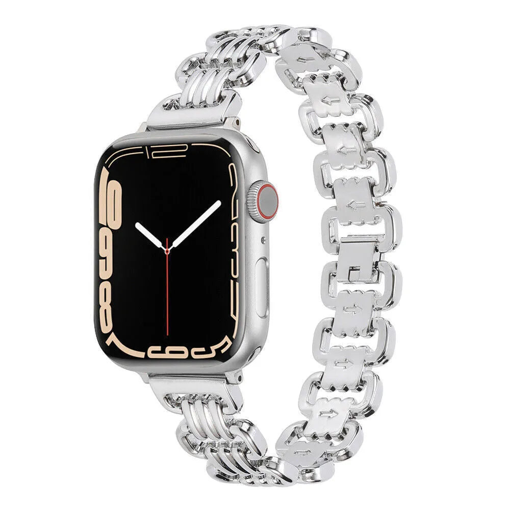 Silver alloy metal replacement bracelet strap for Apple Watch on a table.