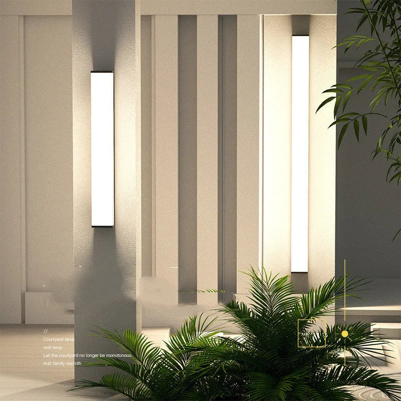 Long 60cm IP65 waterproof outdoor wall light in stainless steel and PC with warm white LED.
