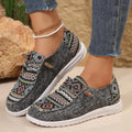 Women's black round toe low-top flat shoes with a rubber sole on a white background