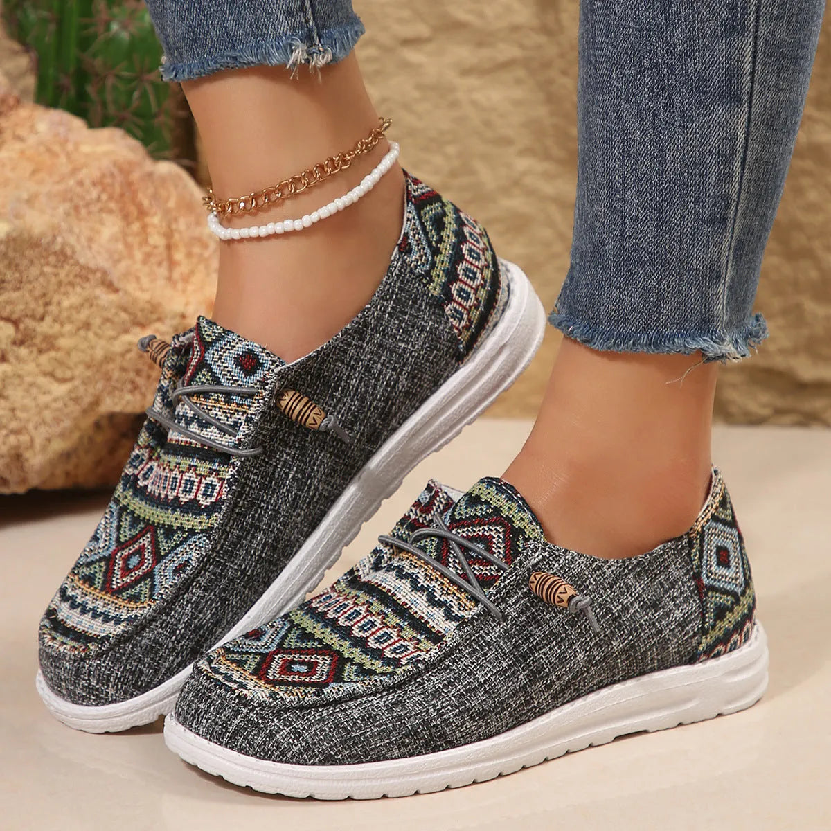 Women's black round toe low-top flat shoes with a rubber sole on a white background