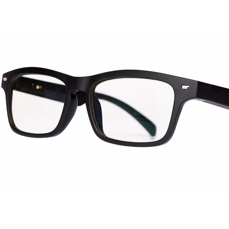 Smart Bluetooth audio glasses with dark lenses on a table, showing temple speakers and a charging case.