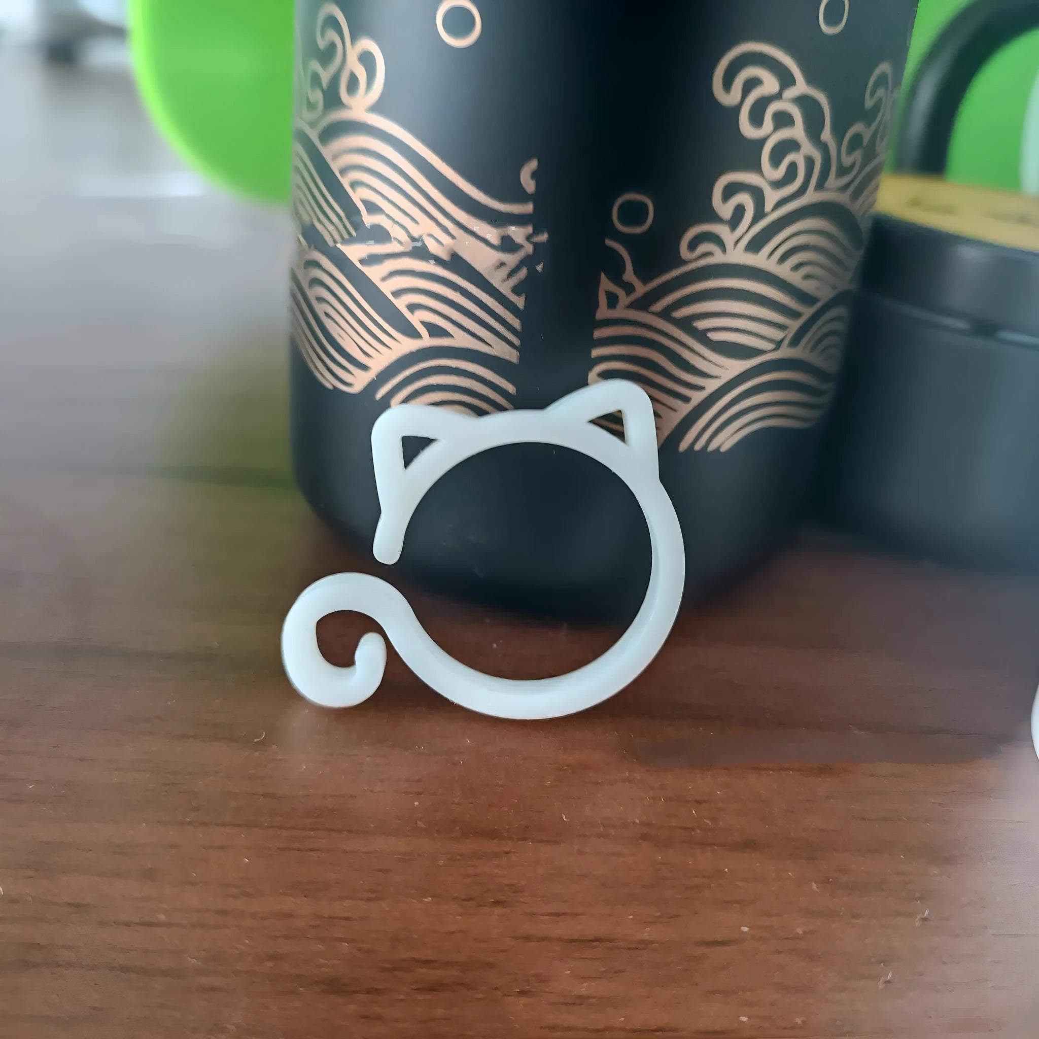 Small cat-shaped plastic clip for gardening in red, yellow, green, and white colours