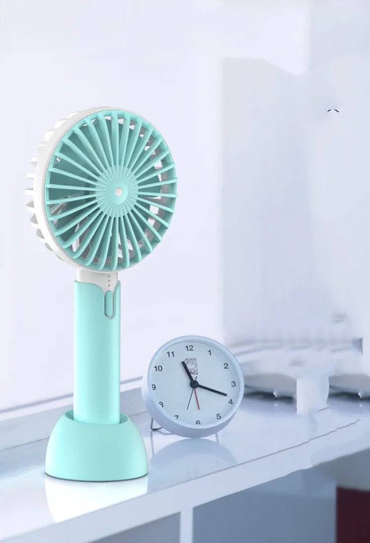 Blue handheld mini USB desk fan with three-speed control and shaking head