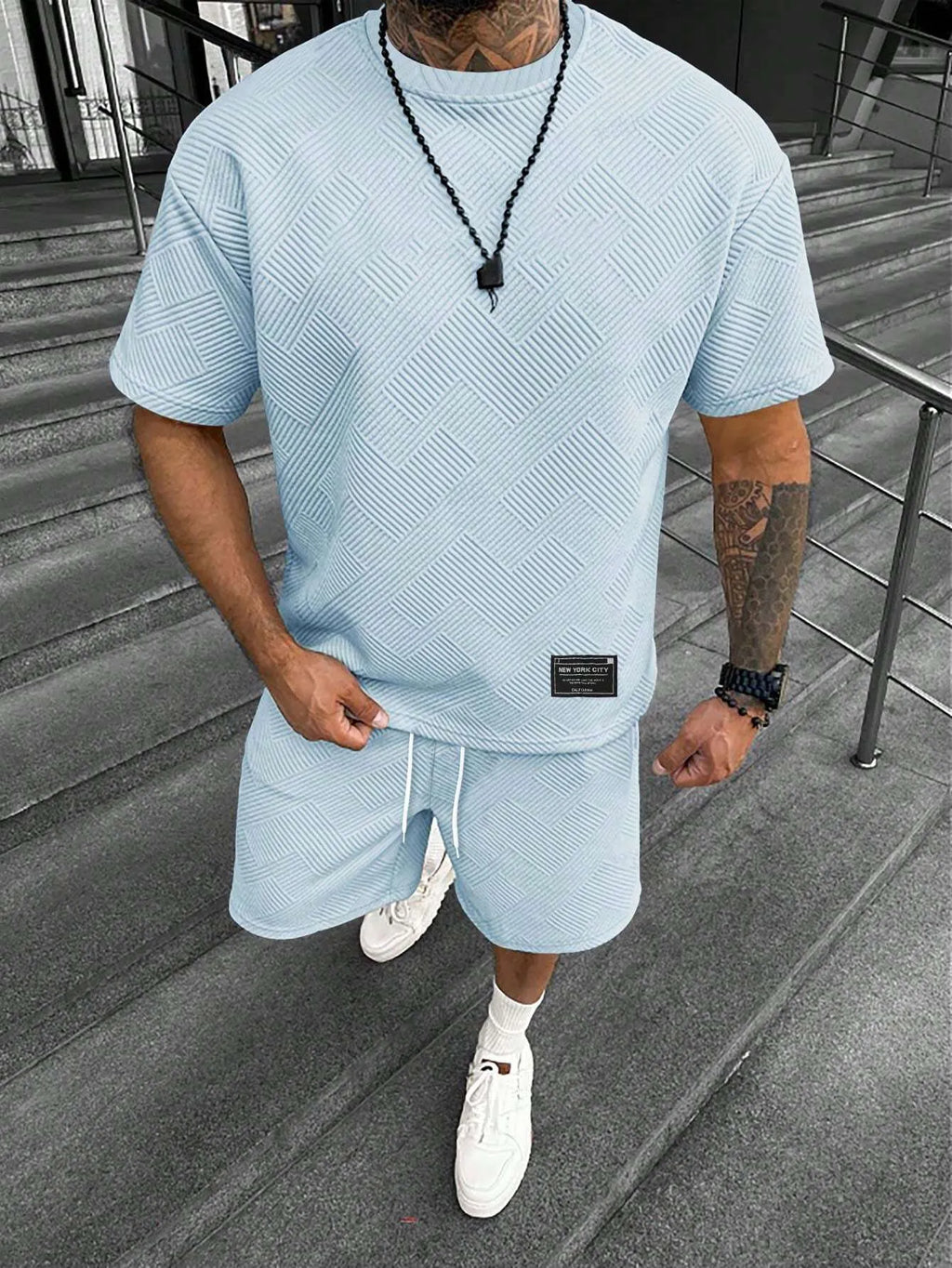 Men's short sleeve top and shorts leisure suit set in chemical fibre blend fabric