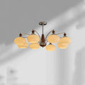 Persimmon glass and chrome chandelier with multiple glass lampshades in a choice of colours.