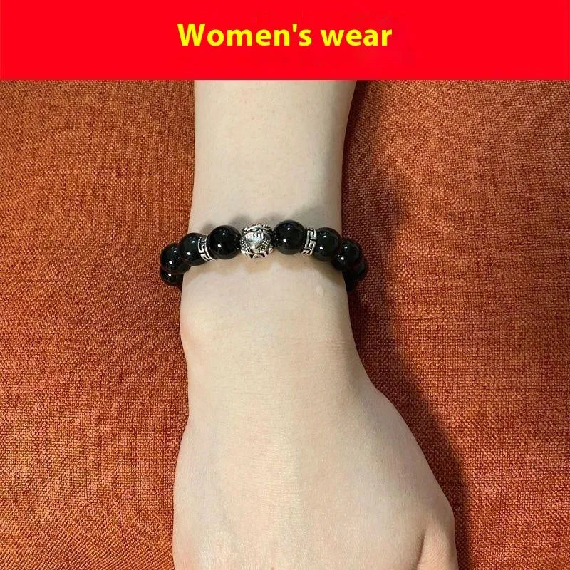 Obsidian bracelet with silver 999 settings showing natural cloud patterns in the beads