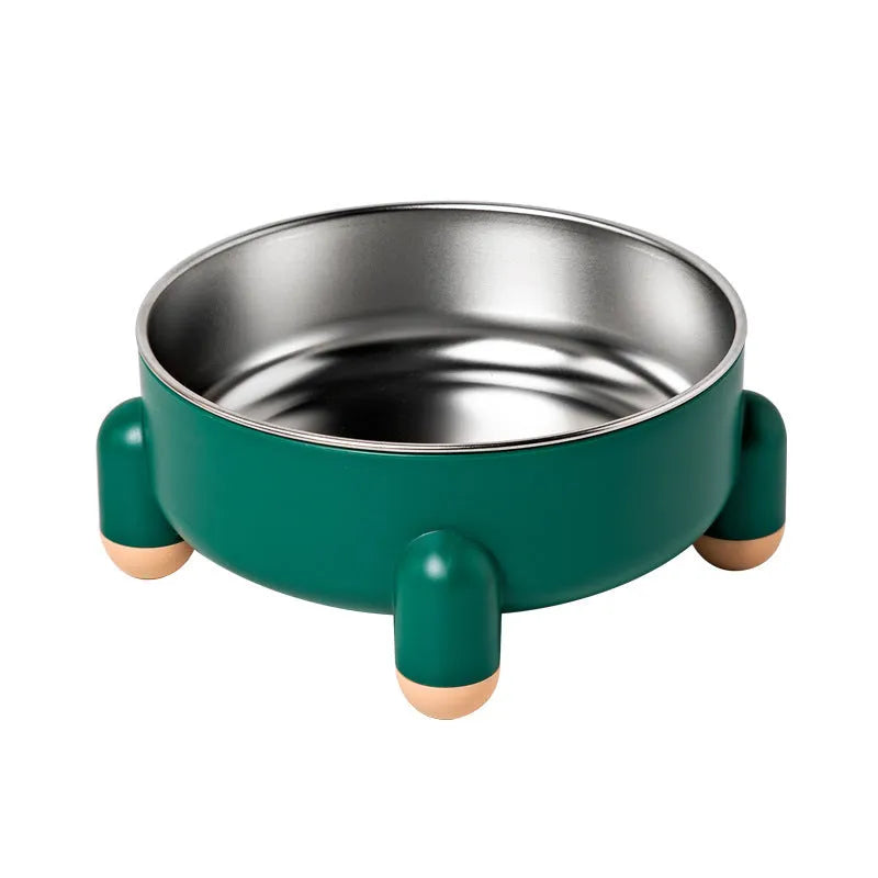 Green non-slip stainless steel pet bowl with high foot base on a floor.