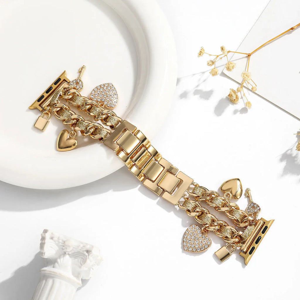 Golden heart pendant ladies watch strap in gold alloy on display with multiple size options visible