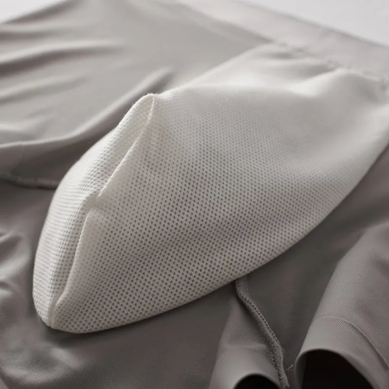Man wearing solid colour ultra-thin nylon boxers with mulberry silk crotch panel.