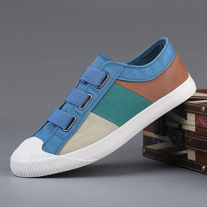 Men's canvas sneakers with rubber sole in multiple colour options showing low top design and elastic band