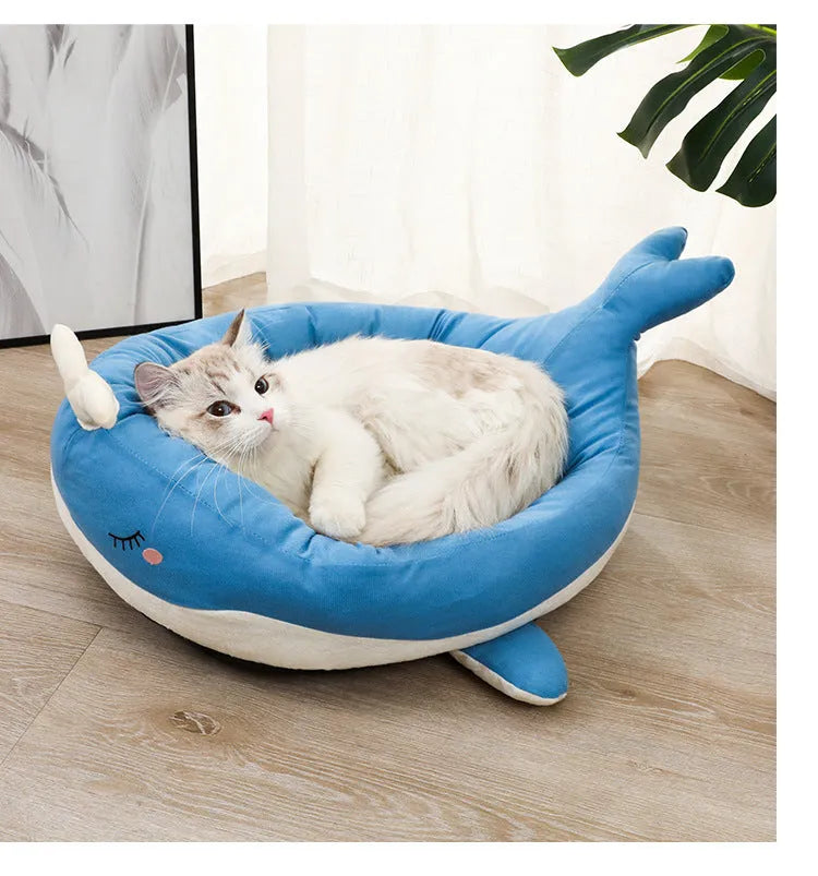 Blue duck-shaped fluffy pet bed sofa for small dogs and cats on wooden floor