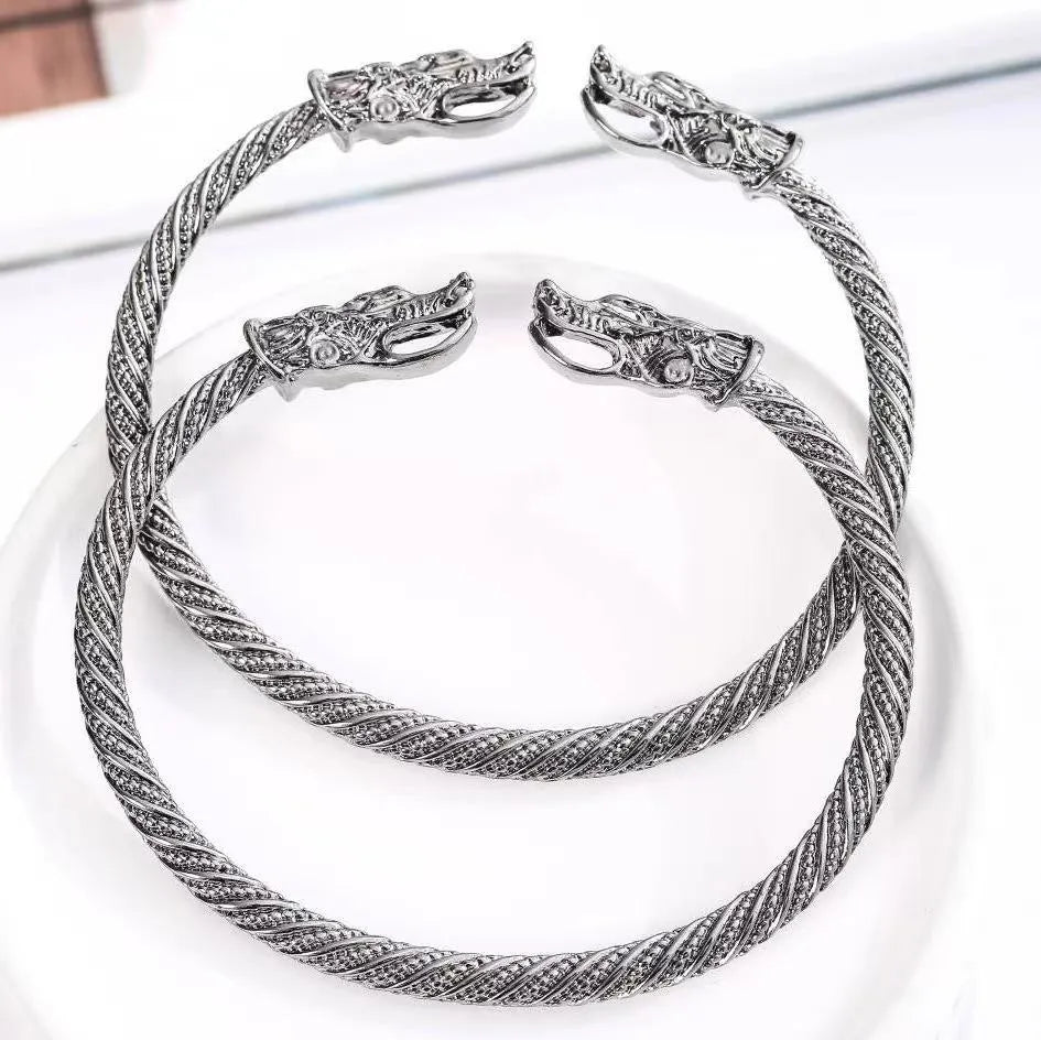 Retro Nordic zodiac cow open cuff bracelet for men in zinc alloy, shown in black, silver, and gold.