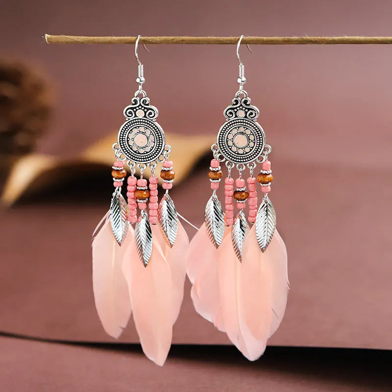 Handmade feather pattern bohemian earrings in multiple colours with leaf design detail